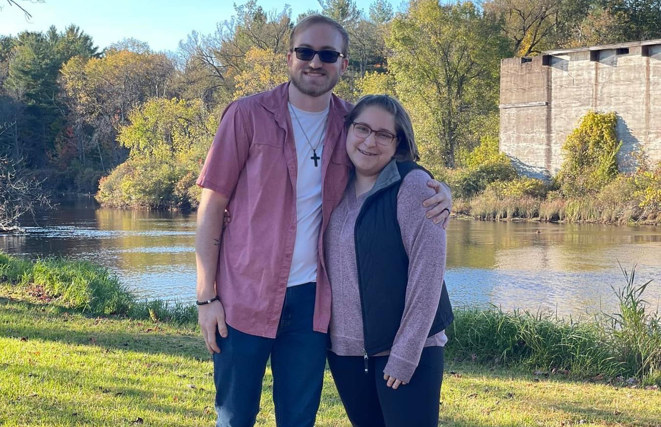 people sitting on gray metal chairs during daytime